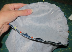 I pinned the top to the crown with the pins facing inwards - a lot less ouchies when sewing.