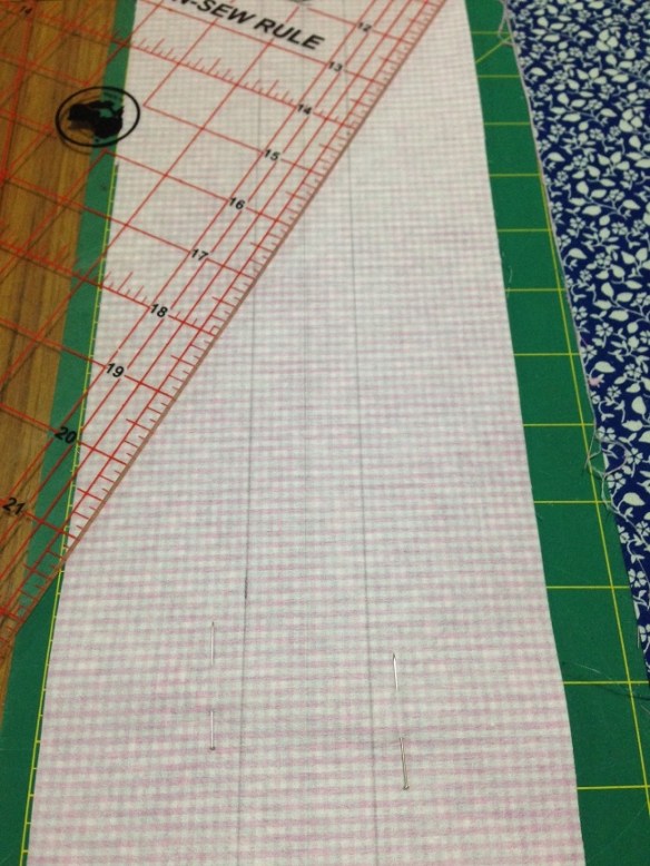 You will need add seam allowances to the pattern buttonbands. The centre line is what you will cut down to create two bands. The outer lines are your stitching lines.